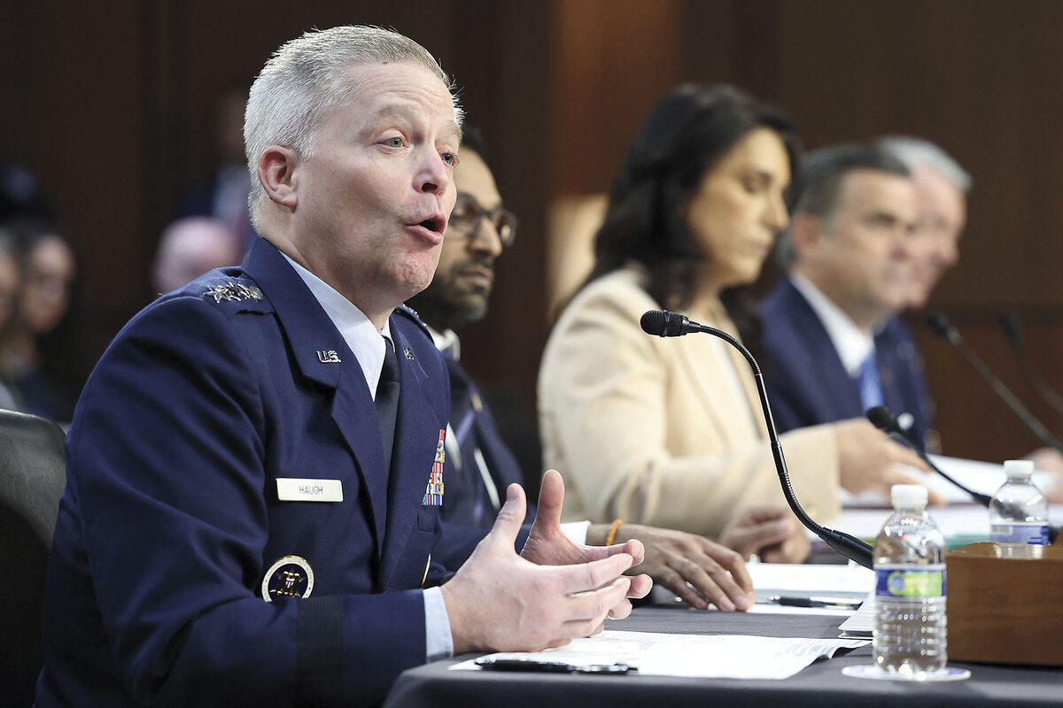 Timothy Haugh, in a dark blue uniform, testifies with other officials on Capitol Hill.